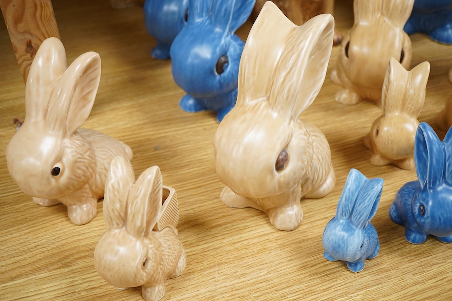 A collection of Sylvac bunny figures, one in the form of a teapot and a pair of dogs, largest 25cm high